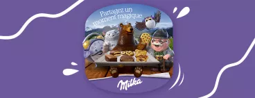 Un père et sa fille partagent un goûter avec Milka biscuits