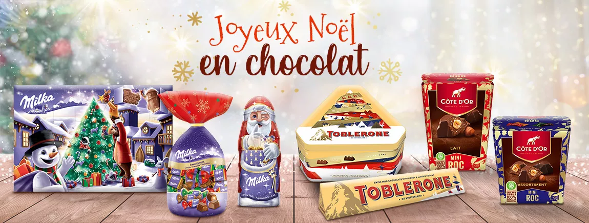 Sur un fond de Noel des packs de Milka Côte d’Or et Toblerone 