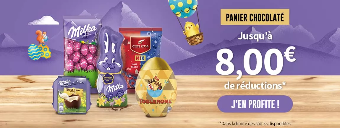 Sur un fond violet, des chocolats Milka dans un décor sur le thème de Pâques