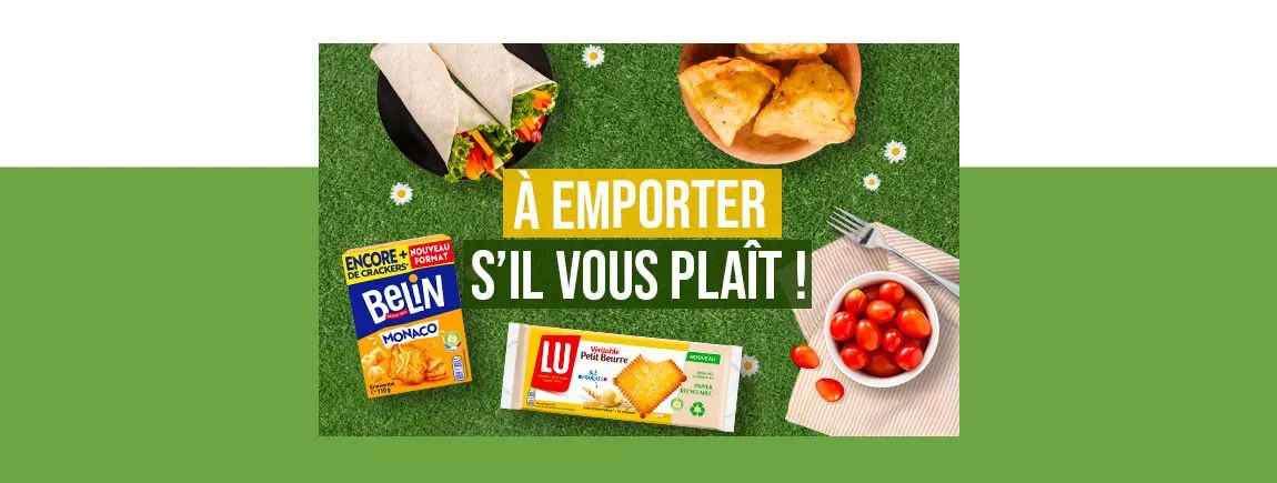 Des plats et des produits LU et Belin posés sur du gazon.